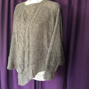 Sweater poncho with sleeves